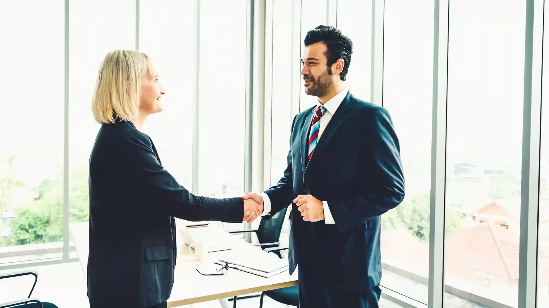 Bussines handshake between a woman and a man.