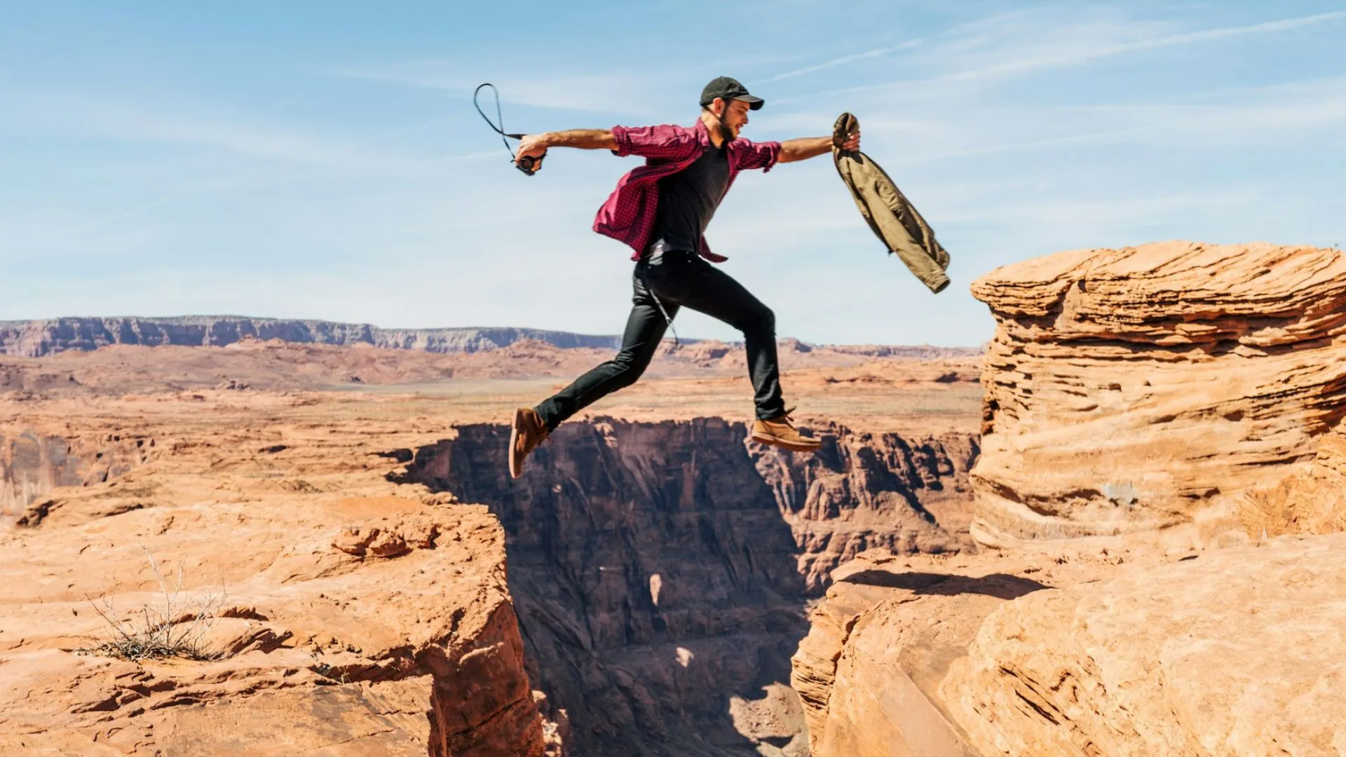 Man jumping over mountains.