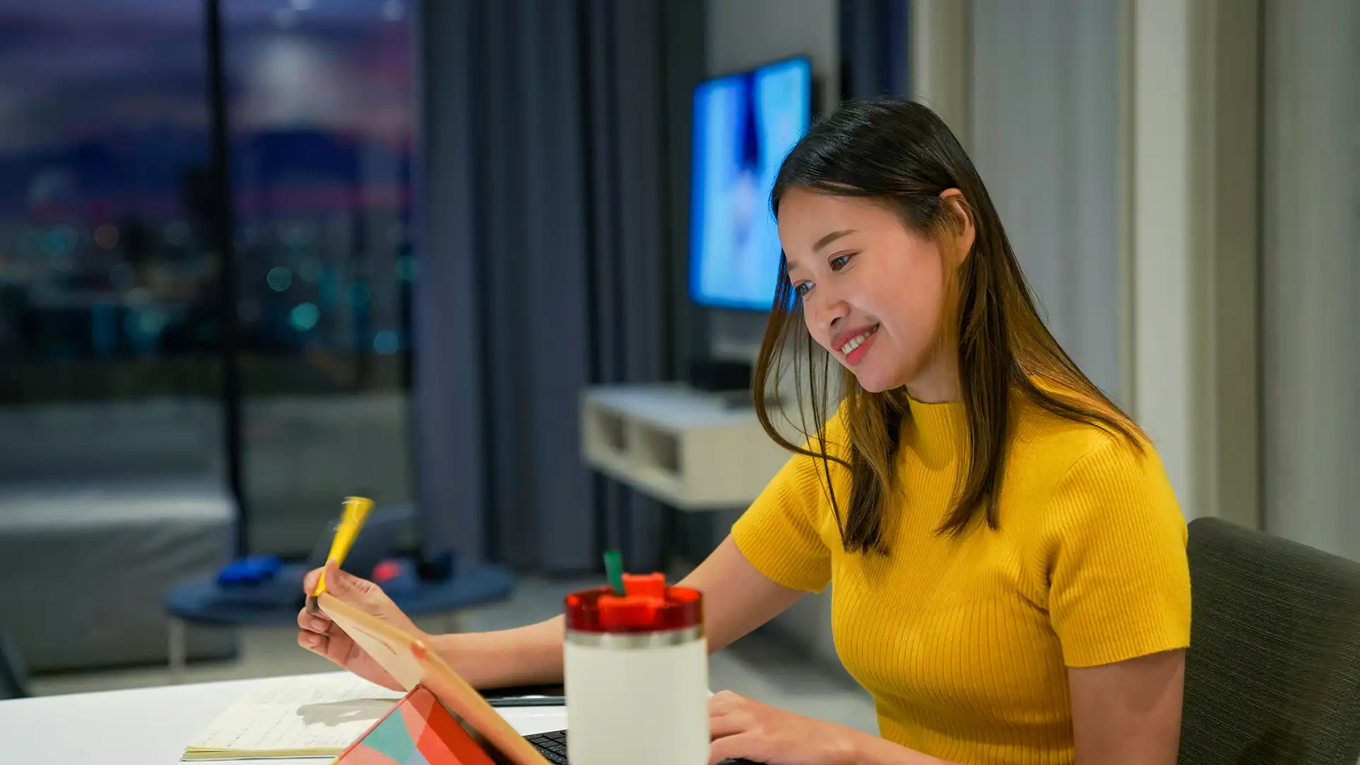 Young woman studying at night.